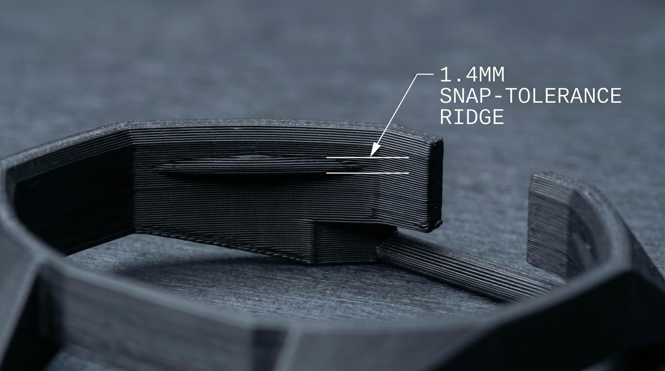 Macro photograph of the laboratory-calibrated 0.25mm snap-fit locking ridge on a custom Swatch Royal Pop watch adapter.